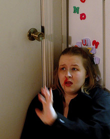 woman with bloody nose hiding